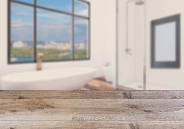 istock Background with empty wooden table. Flooring. Modern bathroom with large window. 1010781712