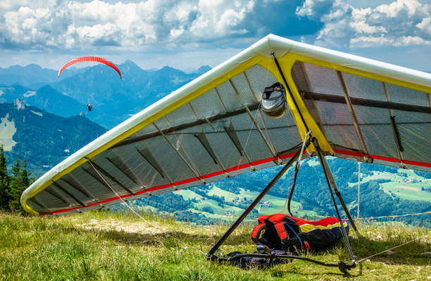 modern hang glider modern hang glider at the alps hang glider stock pictures, royalty-free photos & images
