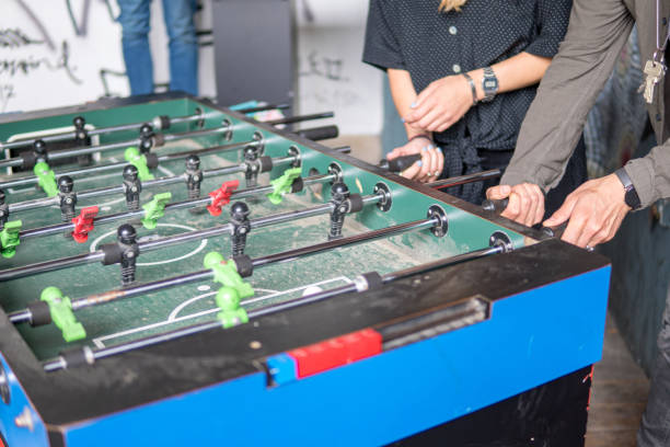 istock Young People Playing Table Football 1010786630