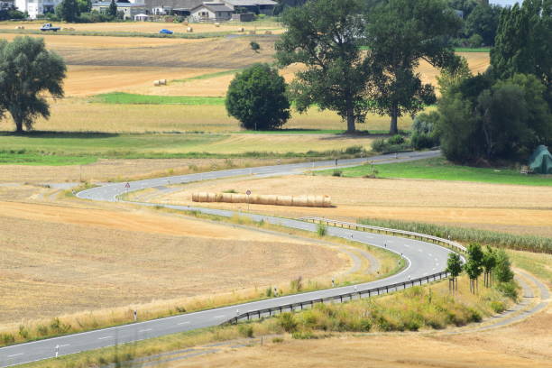 istock twisted country raod at harvest time 1010790190