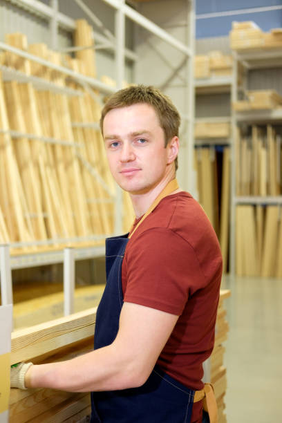 istock worker or seller in construction store or warehouse wood section at work 1010799928