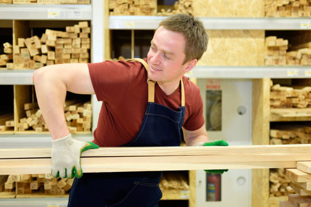 istock worker or seller in construction store or warehouse wood section at work 1010799946