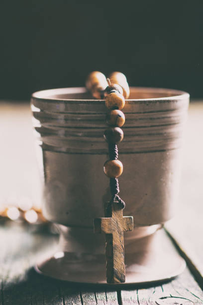 istock Rosary beads and cup of wine 1010819558