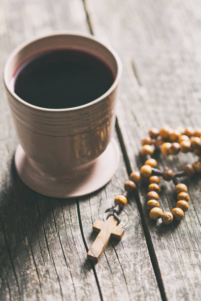 istock Rosary beads and cup of wine 1010819644
