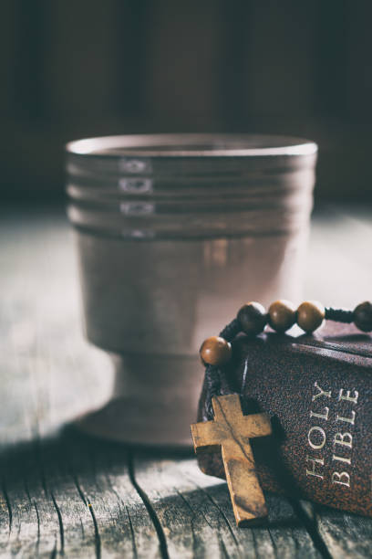 istock Rosary beads and cup of wine 1010819648