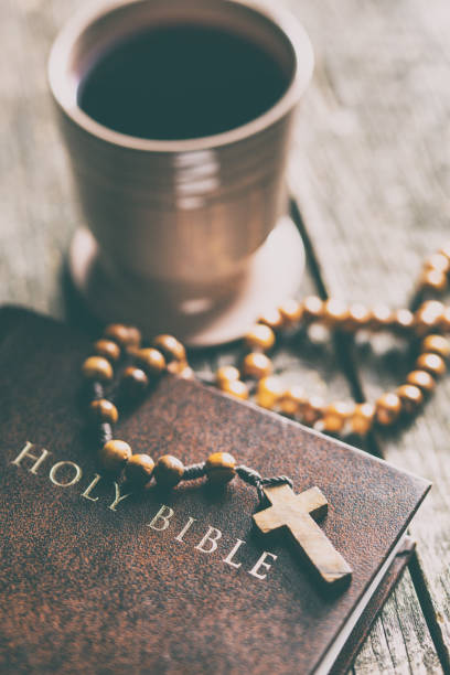istock Rosary beads and cup of wine 1010819664