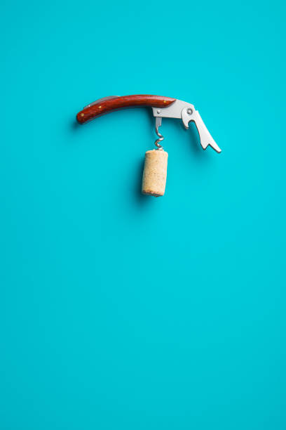 cork and corkscrew blue background. - cork tops imagens e fotografias de stock