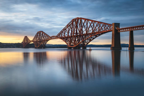 View of Forth Rail Bridge at sunset railway bridge over Firth of Forth near Queensferry in Scotland stock photo