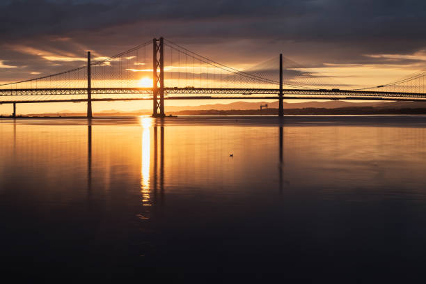 istock Two bridges against the setting sun and the sea 1010826392