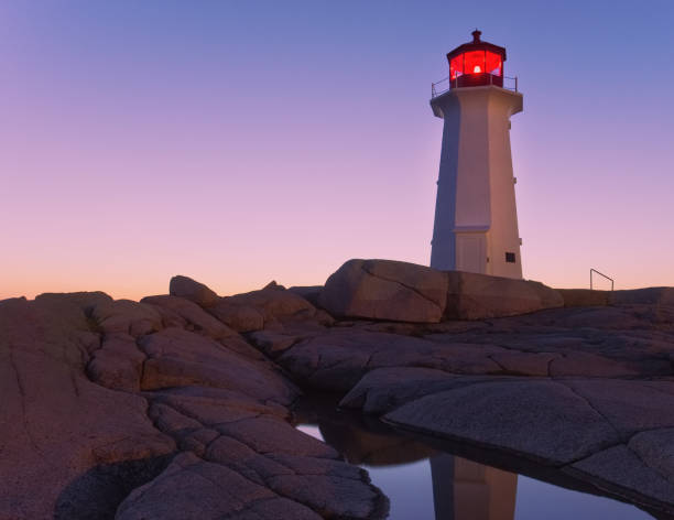 istock Peggy's Cove Lighthouse at Sunset 1010832864