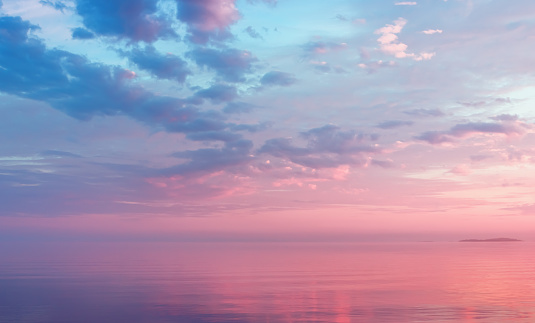 Misty lilac seascape - pink and blue clouds over the water of calm Lake Onega and the small island in the White Nights season - Russia, Republic of Karelia. Soft focus.