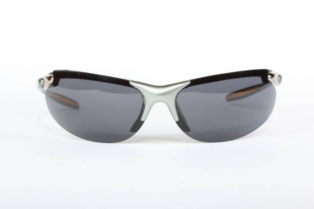 istock Old sport sunglasses with silver plastic frame and a gray glass on a white background 1010834126