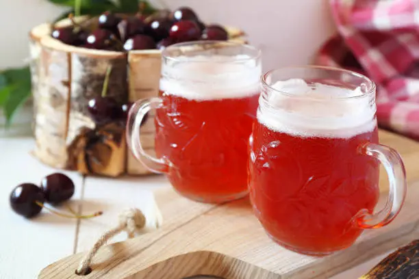 Cold summer drink: Light fruit craft beer and cherry