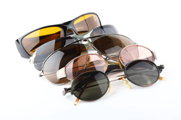 istock Old sunglasses with multi-color glasses on a white background 1010835906