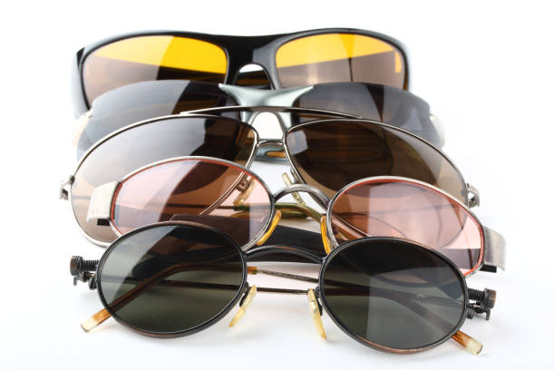 istock Old sunglasses with multi-color glasses on a white background 1010835930