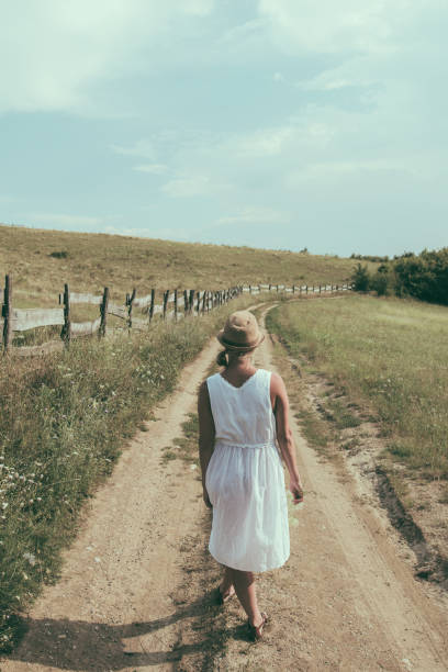 istock Hot summer day. Woman walking at nature. 1010836008
