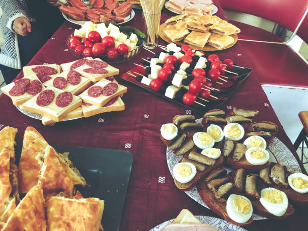 istock Buffet dinner at the cottage. Feast on the nature, sandwiches, pie with meat, khachapuri, fish, vegetables, boiled eggs 1010836744