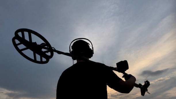 istock Man Holding Metal Detector #2 1010837420