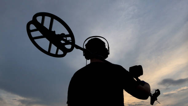 istock Man Holding Metal Detector 1010837438