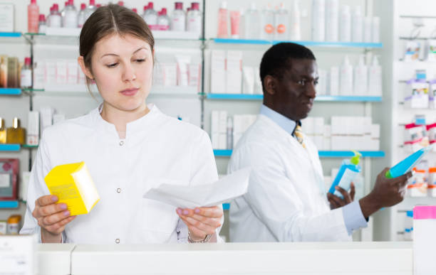 istock female pharmacist dispensing prescription medicines 1010842988