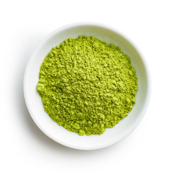 Green matcha tea powder Green matcha tea powder in bowl isolated on white background. chlorella stock pictures, royalty-free photos & images