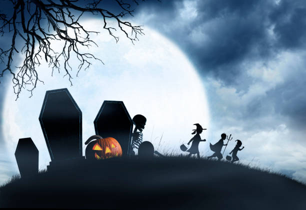 istock Three Trick Or Treating Children Hurry Past Cemetery 1010852368