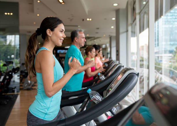 istock People at the gym running on the treadmills 1010878242