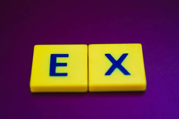EX spelling on yellow plastic cubes