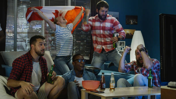 istock Excited patriotic fans with beer watching game 1010884156