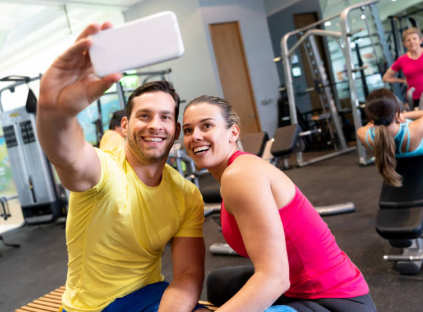 istock Happy couple taking a selfie at the gym 1010889370