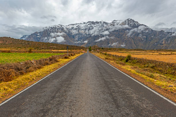 On the road in the Peruvian Andes mountain range with snowcapped peaks in the region of the Colca Canyon near Arequipa, Peru, South America.