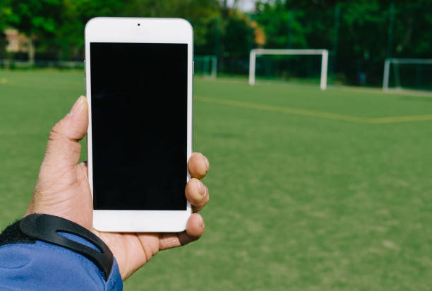 istock Cropped Hand Holding Mobile Phone 1010893038