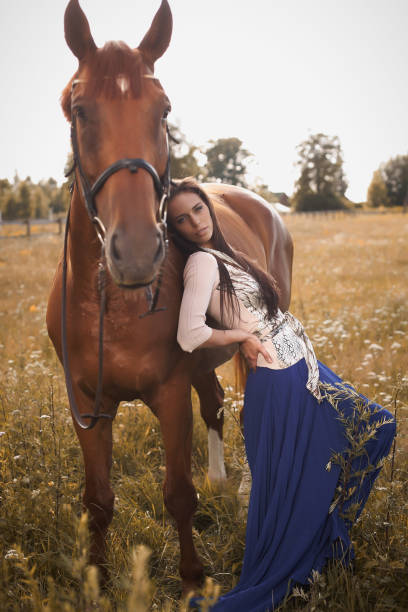 istock Woman with her horse. 1010894106