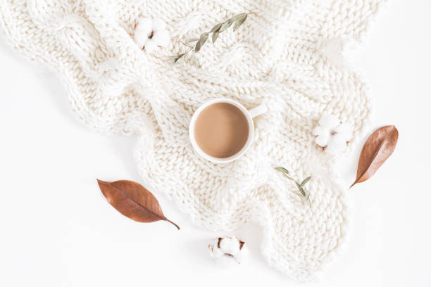 Coffee, autumn leaves, knitted blanket. Flat lay, top view