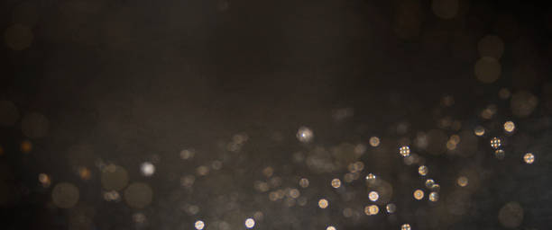 istock Christmas light background.  Holiday glowing backdrop. Defocused Background With Blinking Stars. Blurred Bokeh. 1010897932