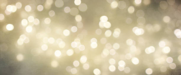 istock Christmas light background.  Holiday glowing backdrop. Defocused Background With Blinking Stars. Blurred Bokeh. 1010905992