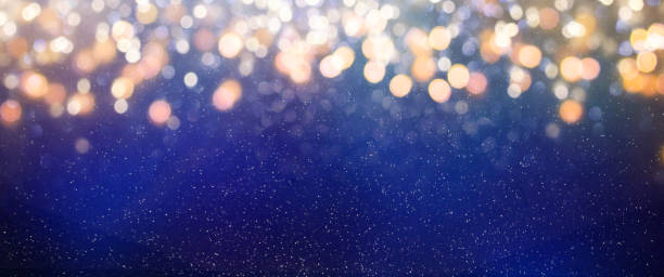 istock Christmas light background.  Holiday glowing backdrop. Defocused Background With Blinking Stars. Blurred Bokeh. 1010906444