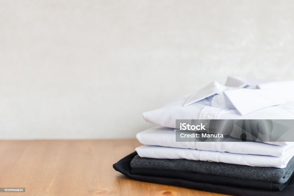 School uniform such as white shirts, sweater and trousers Back to school concept, school uniform such as white shirts, sweater and trousers on the light background School Uniform Stock Photo