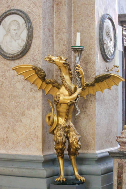Dragon Candelabrum in St Mang Basilica in Fussen, Bavaria, Germany Bronze Candelabrum in the Shape of a Dragon in the Saint Mang Basilica in Fussen, Bavaria, Germany. st mang stock pictures, royalty-free photos & images