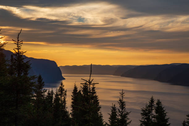 sunset over the saguenay fjord - saguenay imagens e fotografias de stock