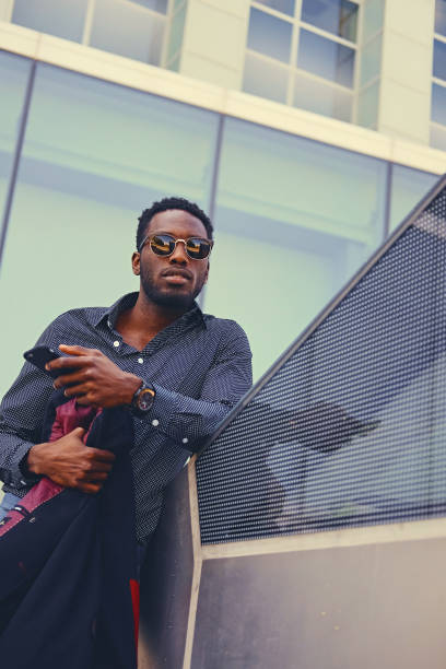 istock Black American male using a smart phone. 1010911444