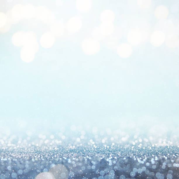 istock Christmas light background.  Holiday glowing backdrop. Defocused Background With Blinking Stars. Blurred Bokeh. 1010915414