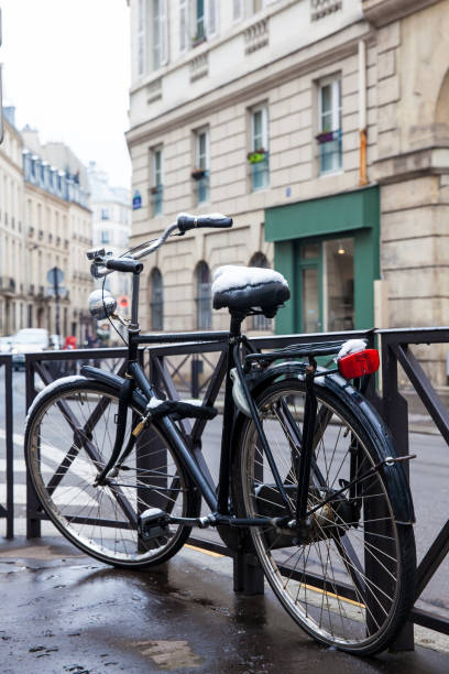 istock Bicycle covered with snow in a freezing winter day 1010932756
