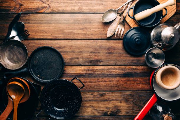 istock Top view of wooden rustic table with various kitchen utensils 1010941386