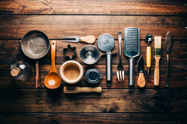 istock Top view of wooden rustic table with various kitchen utensils 1010943862