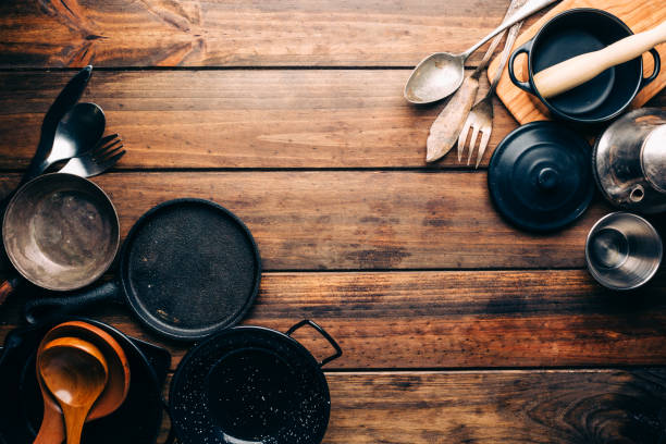 istock Top view of wooden rustic table with various kitchen utensils 1010944252