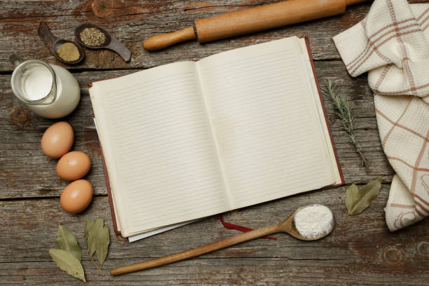 istock Blank cookbook with some ingredients on the wooden table, top view, rustic style 1010952080