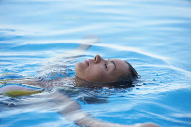 istock Young Woman tourist in infinity pool 1010961418