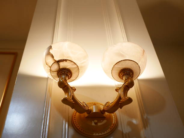 istock Vintage incandescent Edison type bulb on wall 1010987016