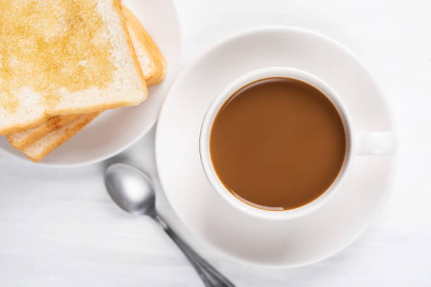 istock Cup of coffee and sliced bread 1010987688